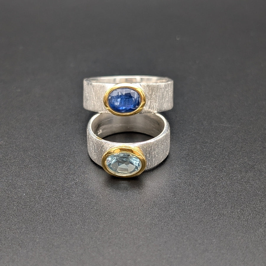 silver ring set with blue topaz and kyanite
