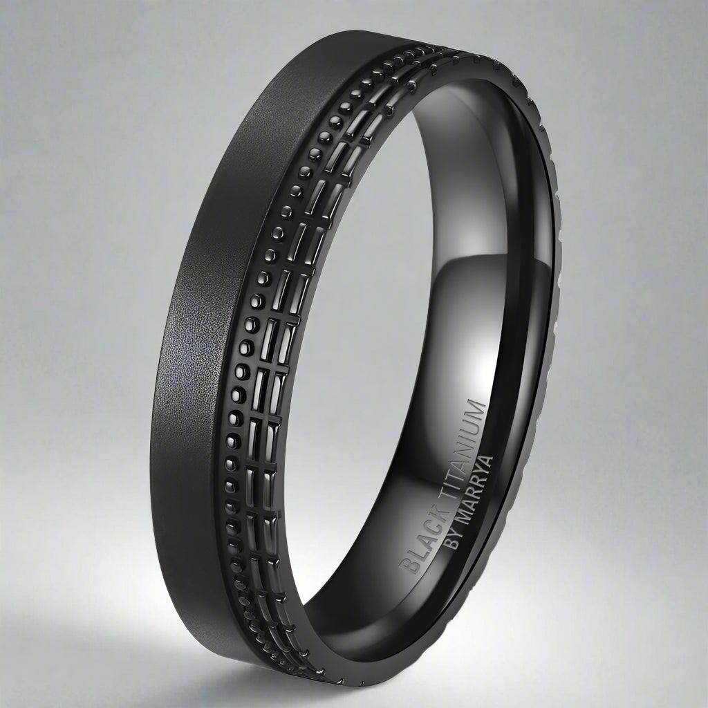 Black titanium ring with textured design on a white background