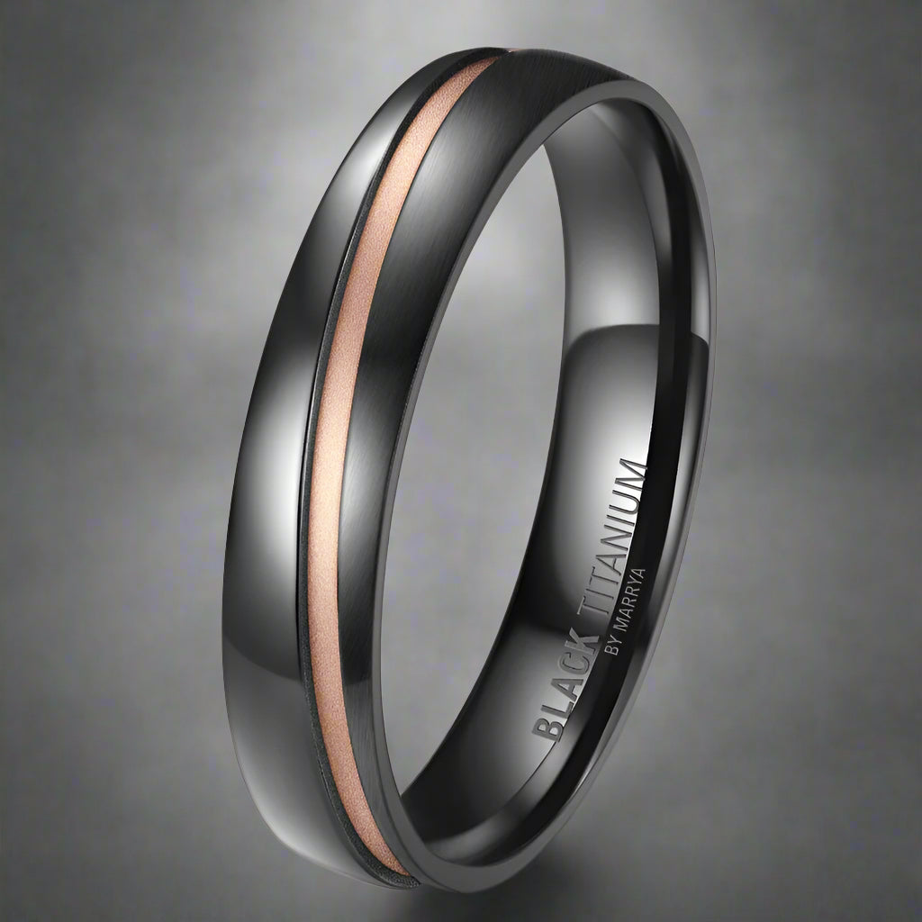 Black titanium ring with rose gold accent on a white background