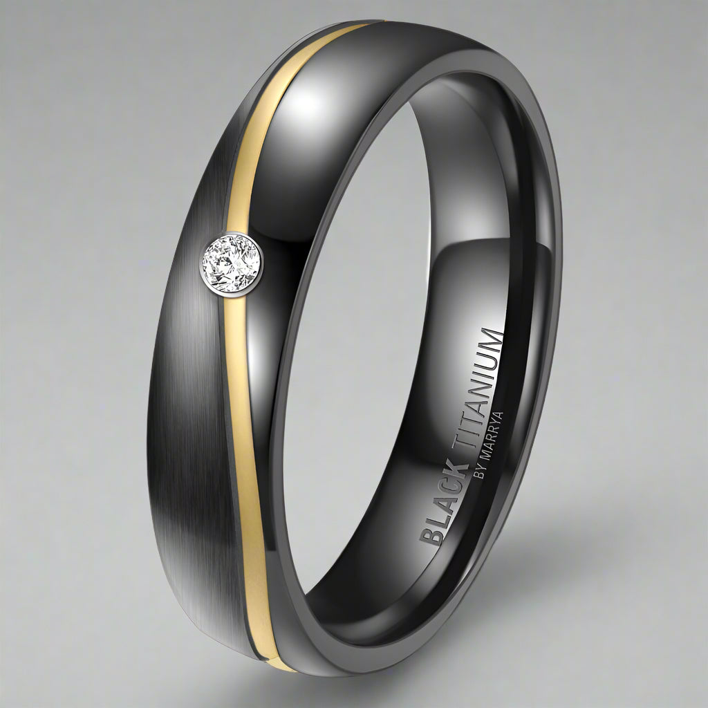 Black titanium ring with gold accent and diamond on a white background