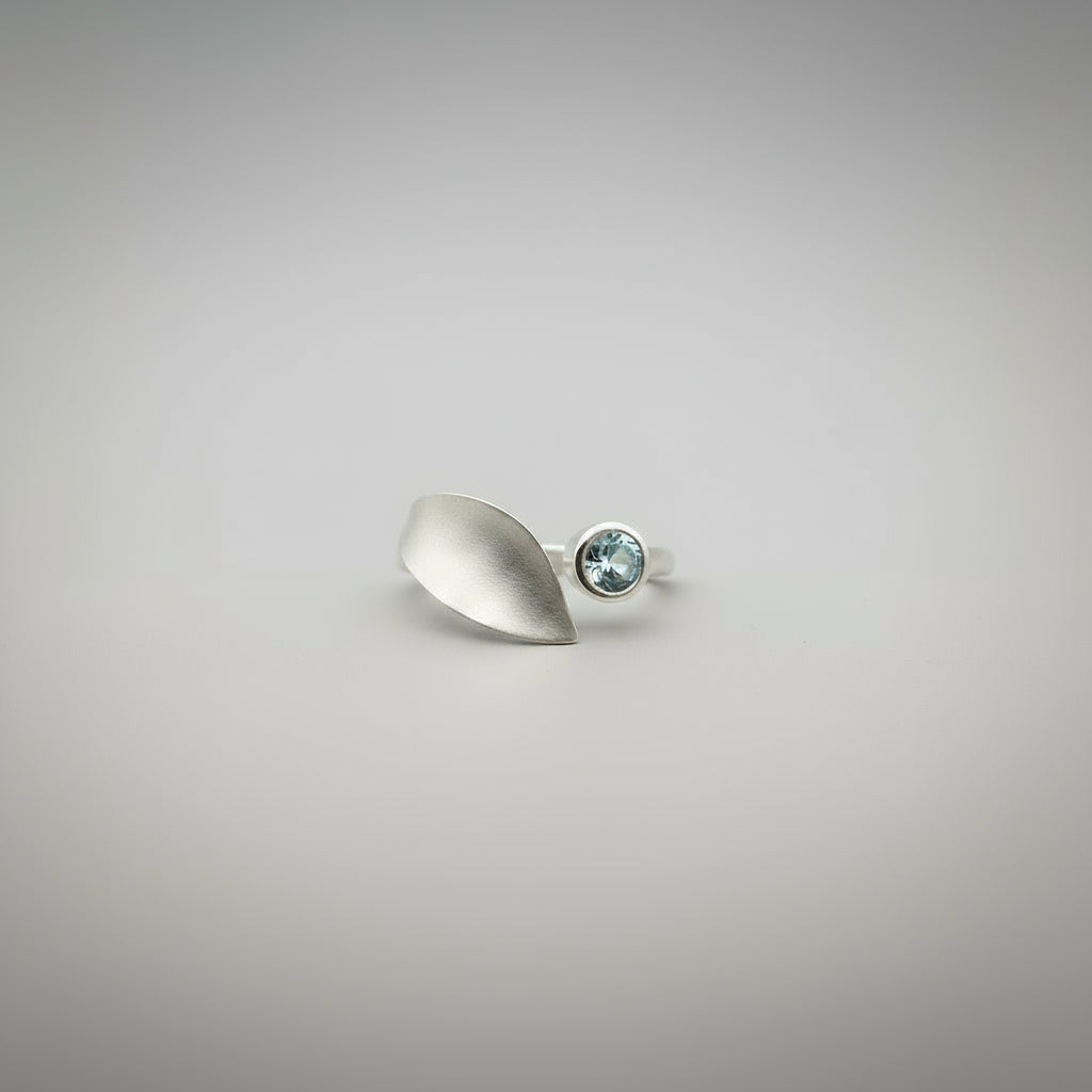 ring on hand blue topaz setting