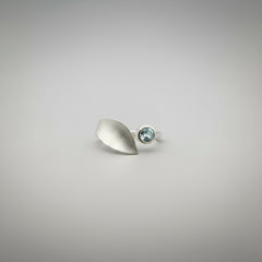 ring on hand blue topaz setting