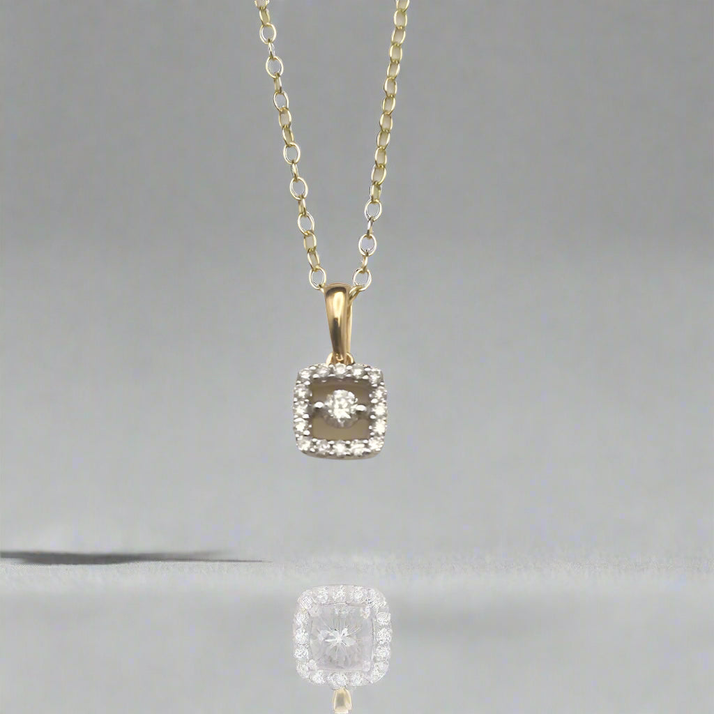 Diamond pendant necklace on a light gray background