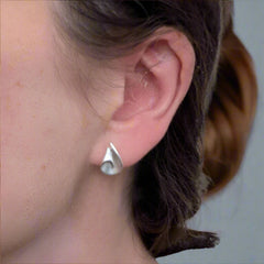 earrings on a womans ear
