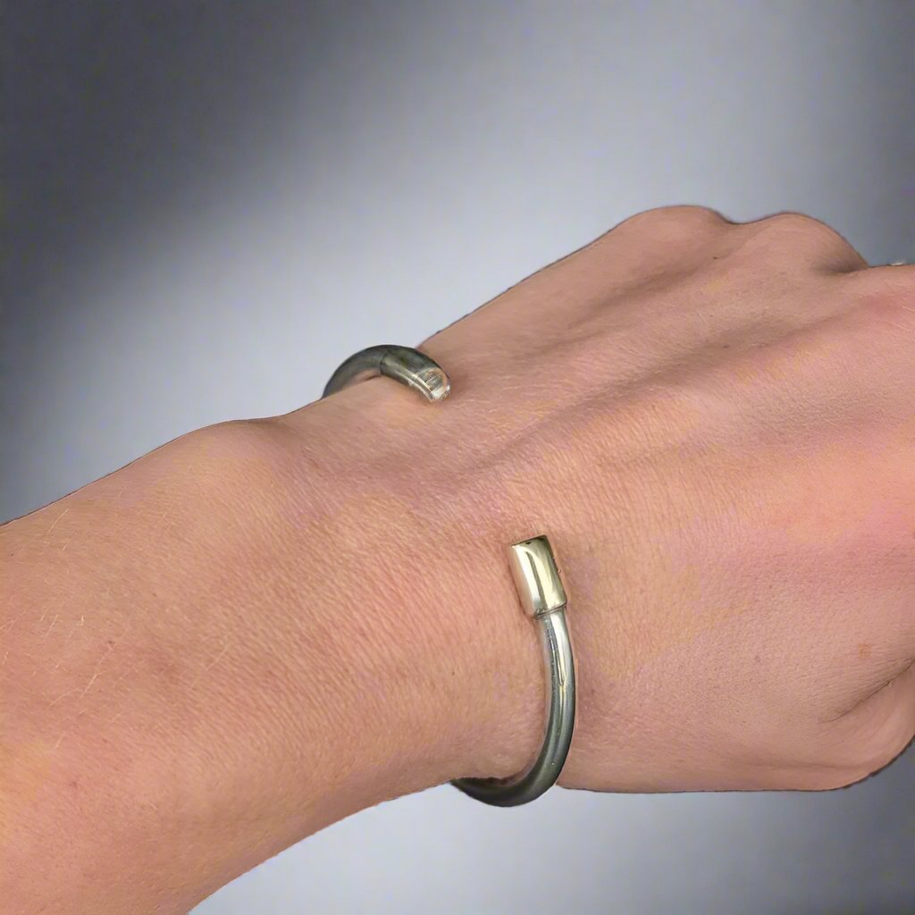 torc bracelet with gold caps - doyle design dublin