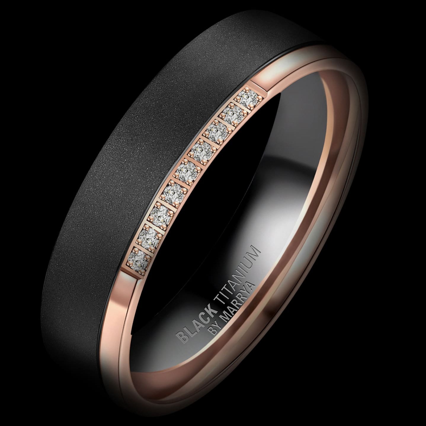 Two rings, one black and one rose gold with diamonds, on a black background.