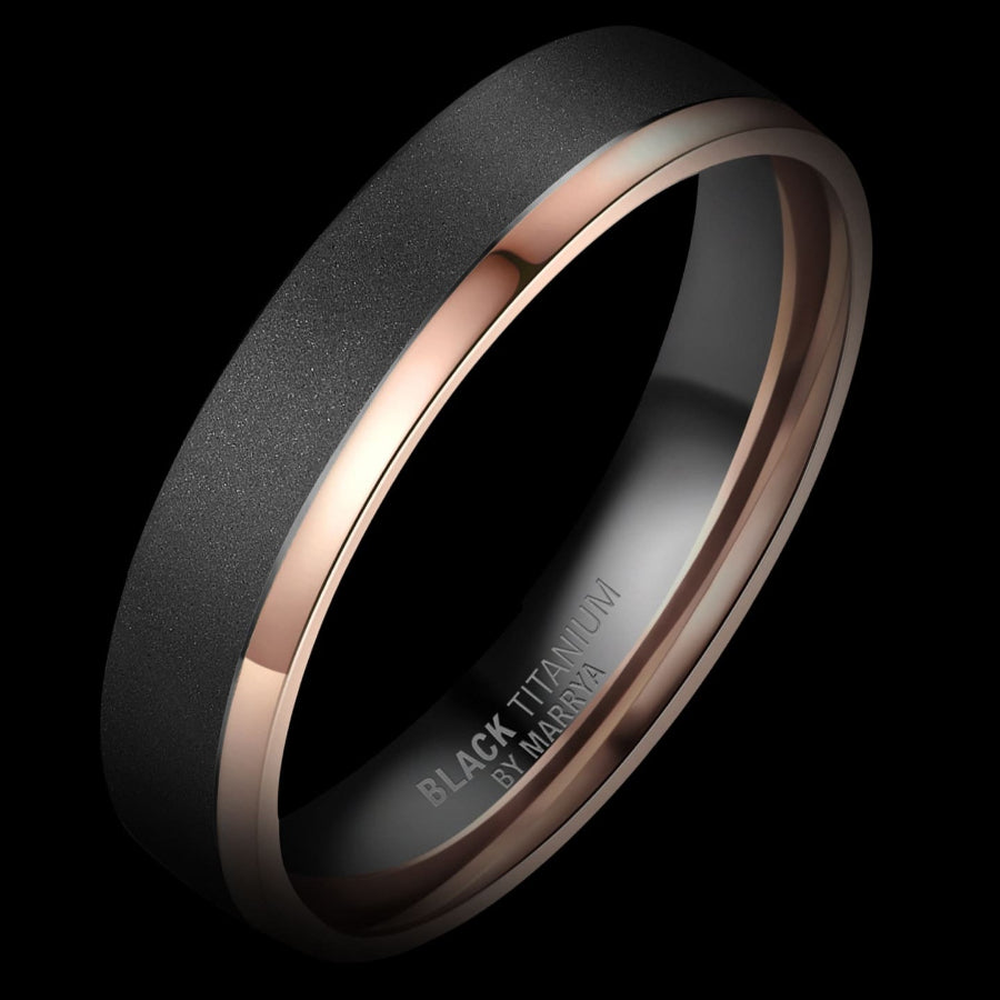 Black and rose gold ring on a black background