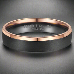 Black titanium ring with rose gold accent on a white background