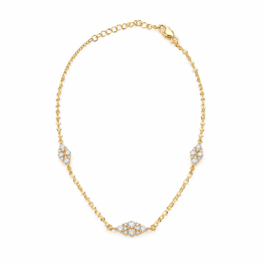 A delicate gold chain bracelet with three pavé diamond clusters spaced along the chain, displayed on a clean white background.