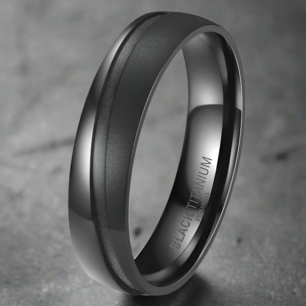 Black titanium ring on a white background