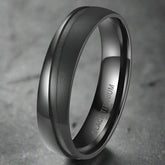 Black titanium ring on a white background