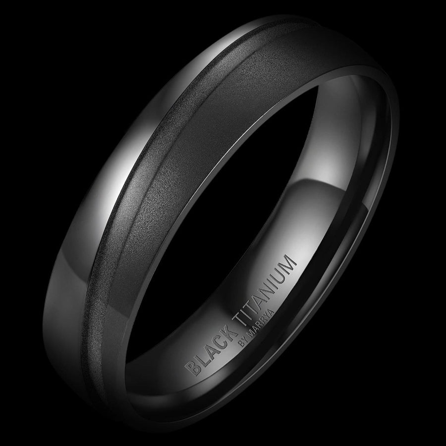 Black titanium ring on a black background m- doyle design dublin