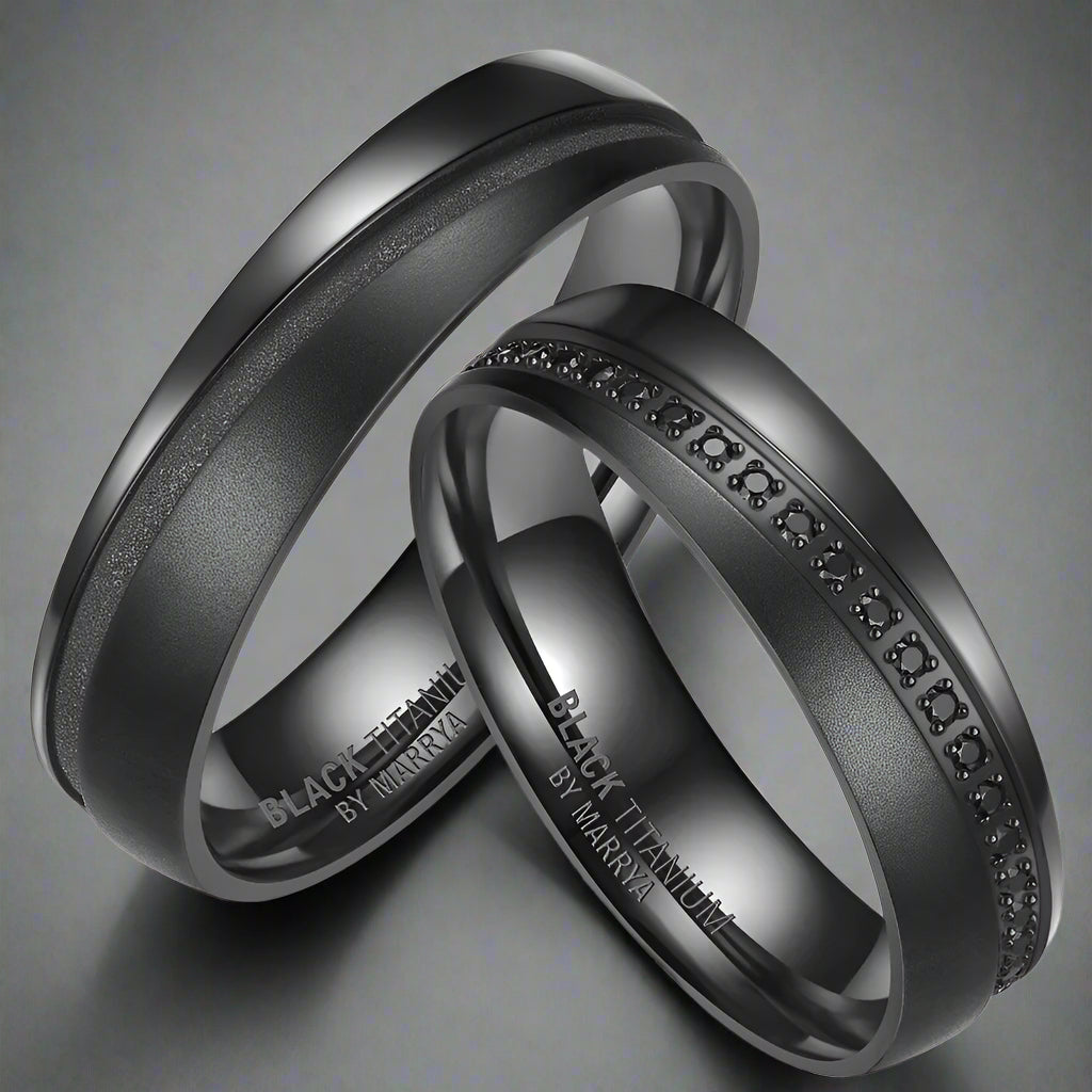 Two black rings with engraved text on a white background