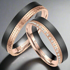 two black titanium and rose gold rings