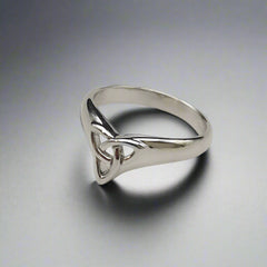 Silver ring with a triangular design on a light gray background