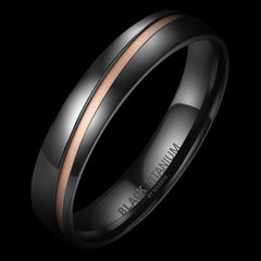 Black titanium ring with rose gold inlay on a black background