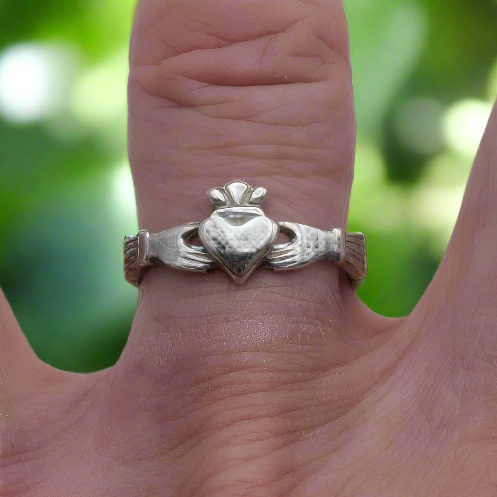 claddagh ring in silver on finger doyle design dublin