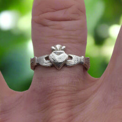 claddagh ring in silver on finger doyle design dublin