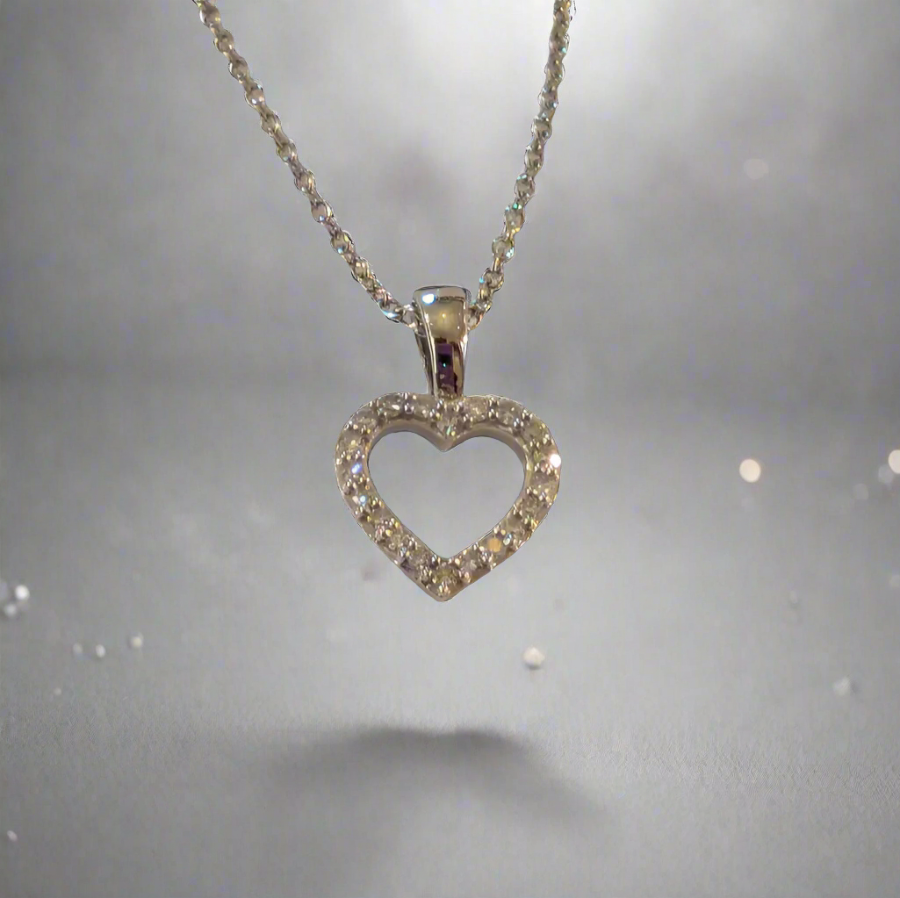 diamond and white gold heart shaped pendant