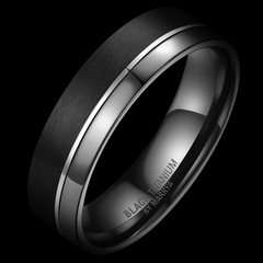 Black and silver ring with engraved text on a black background