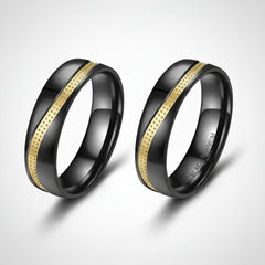 Black titanium ring with yellow gold wave