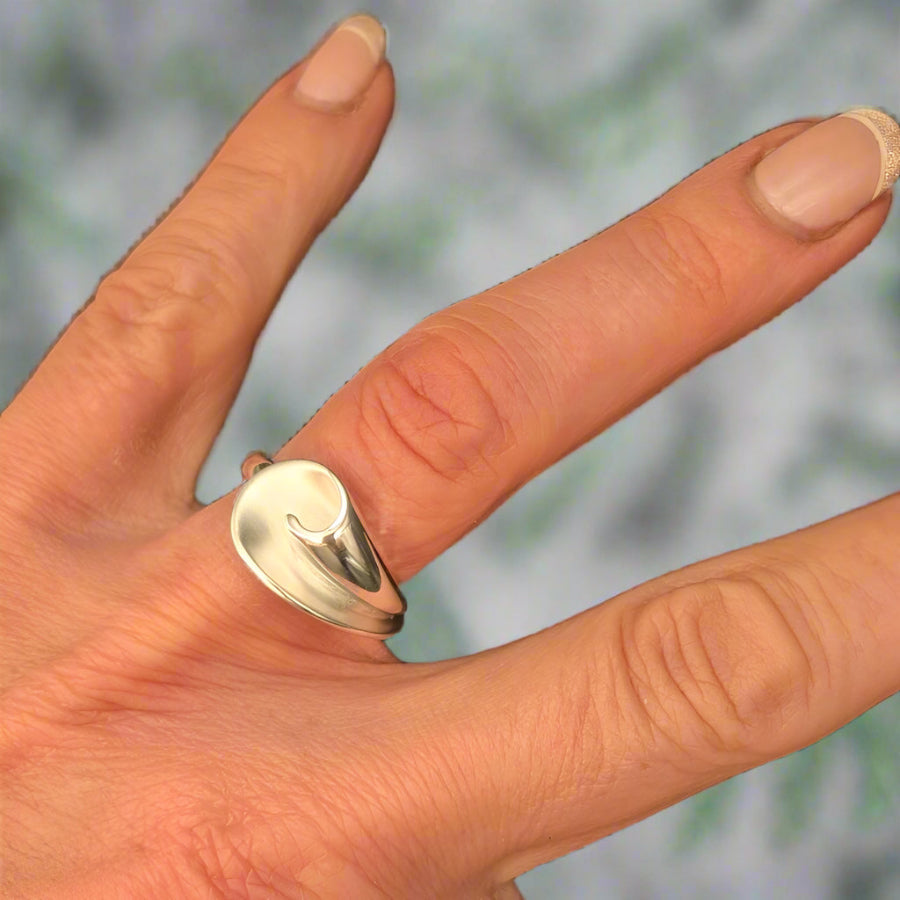 ring on a womans hand flora silver ring