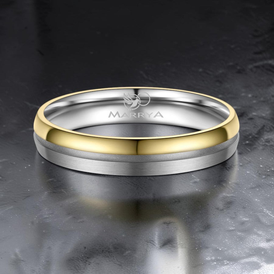 Two-toned ring with gold and silver finish on a dark surface, 