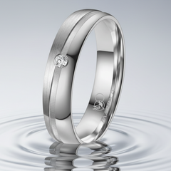 Grey titanium ring set with a diamond