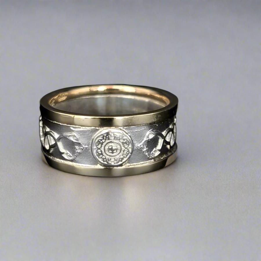 two tone ring with warrior shield in the center and yellow gold walls