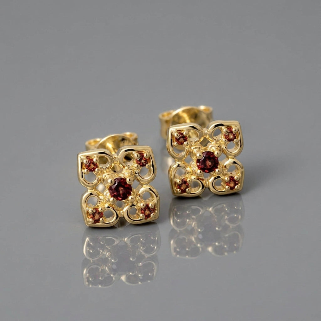 rosette earrings set with garnet in yellow gold