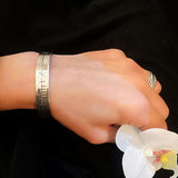 Ogham Bracelet in silver on womans wrist - doyle design dublin