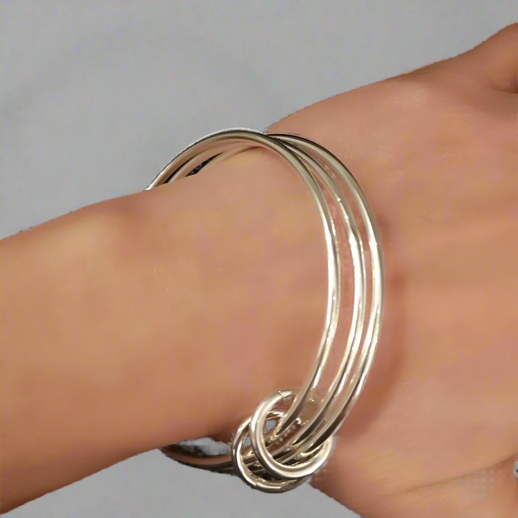 Multi strand silver bracelet on the wrist - Doyle Design Dublin