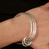 Multi strand silver bracelet on the wrist - Doyle Design Dublin
